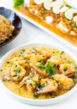 Bowl of shrimp prawn curry, Thai yellow curry with seafood, Thai traditional red curry soup with shrimp, prawns and coconut milk, Thai traditional food, Tom Yum Goong, Traditional thai soup