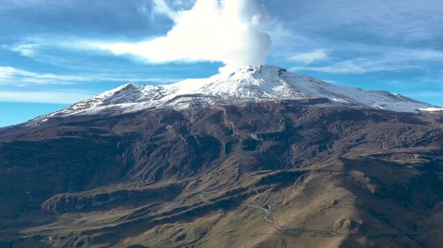 Nevado del Ruiz Volcano Covered with Snow above the Andean Highlands in Colombia. Aerial View.