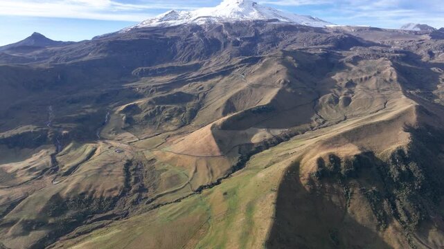 Nevado del Ruiz Volcano Covered with Snow above the Andean Highlands in Colombia. Aerial View.