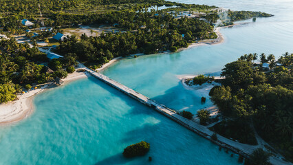 A long narrow causeway bridge connects two seperate atolls. © gshakwon