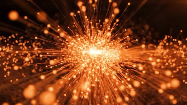 Abstract orange particles from optical fiber displayed in a close up
