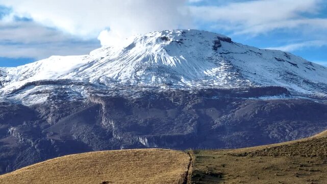 Nevado del Ruiz Volcano Covered with Snow above the Andean Highlands in Colombia. Aerial View.