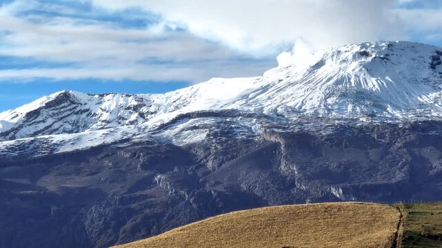 Nevado del Ruiz Volcano Covered with Snow above the Andean Highlands in Colombia. Aerial View.