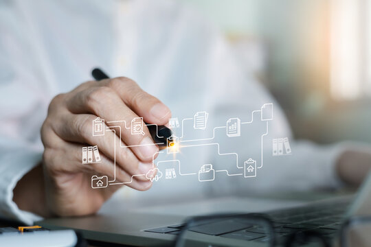 Businessman hand using stylus pen interacting with virtual screen showing document management system, cloud storage, and digital workflow automation. Paperless office technology concept.