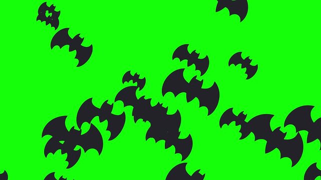 Numerous black bat silhouettes scatter across a bright, solid green screen backdrop, perfect for spooky Halloween effects.