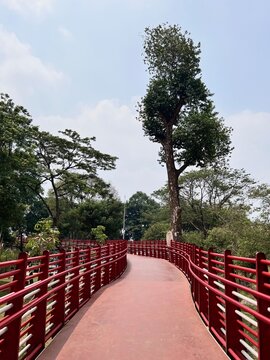 A elevated jogging track and skybridge winding through Taman Bendera Pusaka, a public park in South Jakarta, Indonesia.
