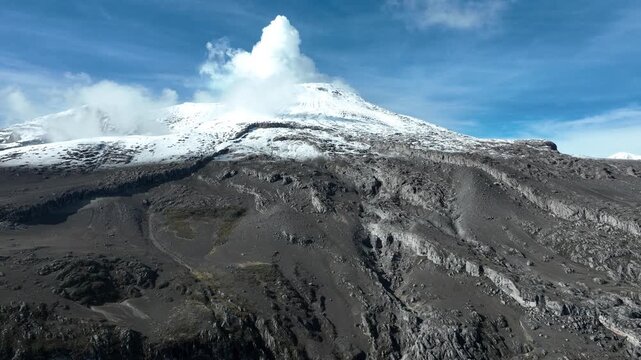 Nevado del Ruiz Volcano Releasing a Large Plume from Its Snow Covered Summit in Colombia. Drone Aerial View.