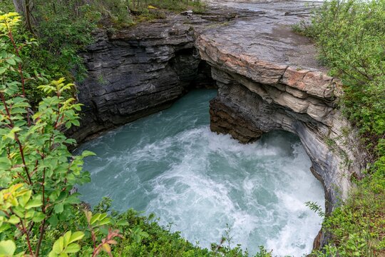 Turquoise River Flowing Through Rocky Gorge