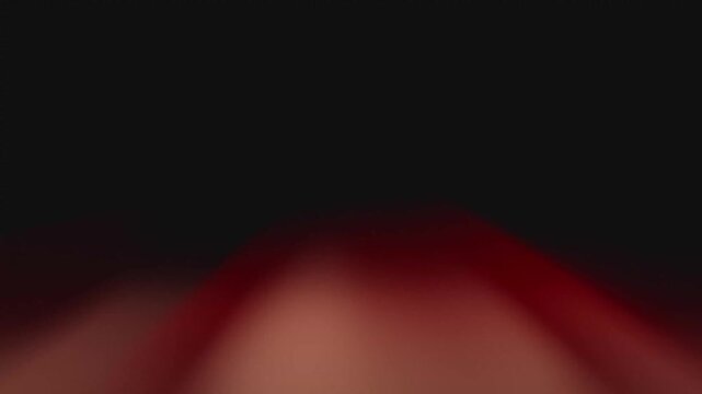 Red light streaks flashing across dark background motion video clip creating dramatic abstract visual effects with fast glowing neon streaks passing through deep shadows in dynamic cinematic digital f