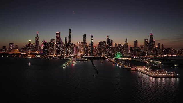Aerial view of Chicago skyline at twilight with Navy Pier and illuminated Ferris wheel over Lake Michigan on October 6 2026