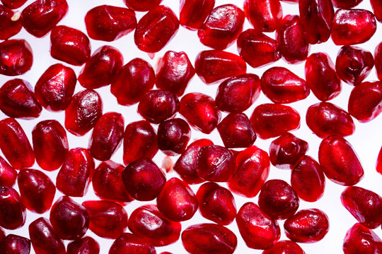Rube juicy pomegranate background. Pomegranate garnet fruit background. Red Background of grenade fruit. Textured pomegranate, Punica granatum.