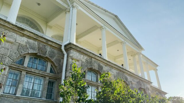 Smooth upward tilt shot of an empty palace. Camera movement reveals the Cameron Gallery in Catherine Park, Pushkin, Saint Petersburg, evoking deep peace and quiet wonder.