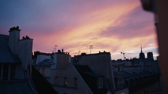 Beautiful sunset sky over rooftops of paris