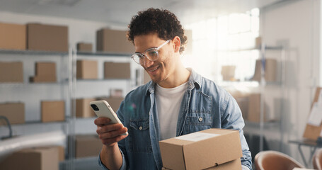 Ecommerce, man and phone in office with package, logistics and track online order on courier website. Happy, person and boxes with tech, supply chain and mobile app for reading distribution update. © peopleimages.com