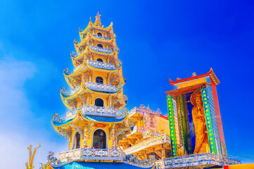 popular tourist attraction is Linh Phuoc temple decorated with colorful mosaics in Da Lat, Vietnam. Facade and interior are beautiful Buddhist Linh Phuoc pagoda in Asia © alexkoral