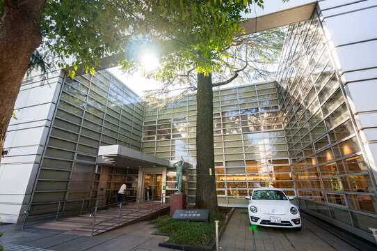 SUGINAMI-KU, TOKYO, JAPAN - SEPTEMBER 24, 2026: Entrance facade and modern glass exterior of Suginami City Central Library in Suginami-ku, Tokyo.
