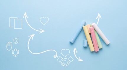 Fototapeta premium Top View of Colorful Chalk Sticks on Blue Background with White Line Art Icons Representing Strategy, Teamwork, Care, and Education Concept for Creative Business and School Presentation