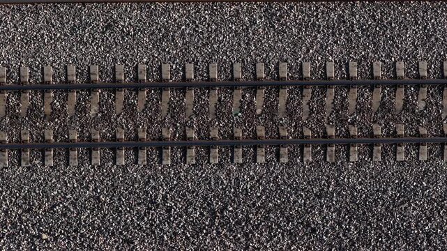 Top down static view of railroad tracks on gravel