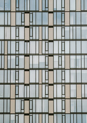 Fototapeta premium Modern building facade with geometric window pattern