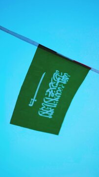 Saudi Arabia national flag featuring the white Shahada and sword on a green field, representing the Kingdom of Saudi Arabia, national identity and National Day on September 23.