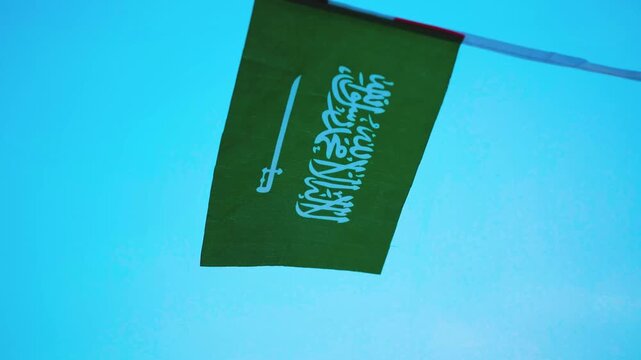 Saudi Arabia national flag featuring the white Shahada and sword on a green field, representing the Kingdom of Saudi Arabia, national identity and National Day on September 23.