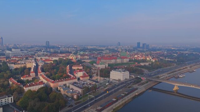 Aerial Drone Footage of Warsaw Cityscape at Sunrise over the Vistula River