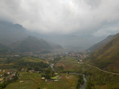 Misty Mountain Valley With Village and River