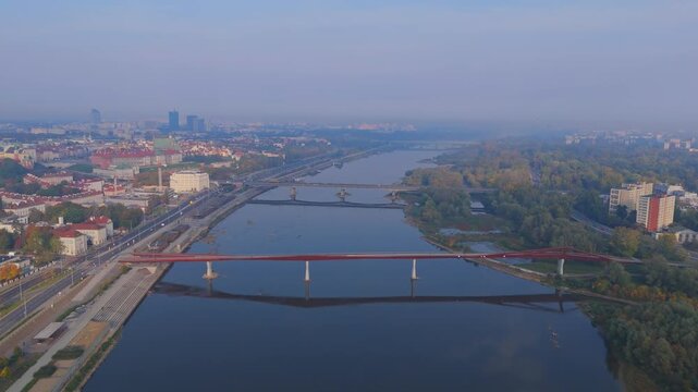 Aerial Drone Footage of Warsaw Cityscape at Sunrise over the Vistula River