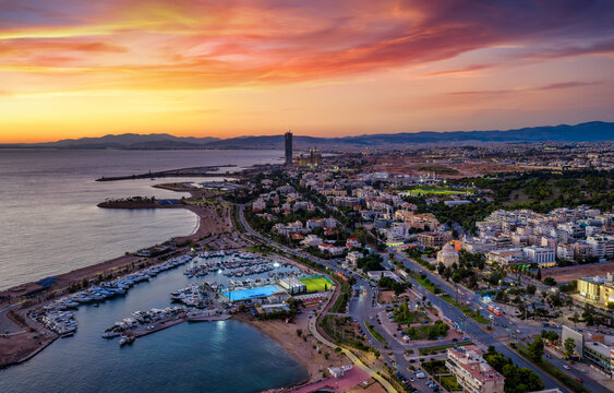 Aerial view of the southern coast of Athens, Greece, with Glyfada district, boat marinas and beaches during sunset time