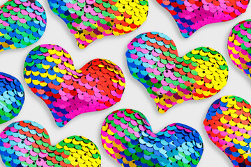 Creative pattern of shining colored hearts of sparkling sequins, 14 february Valentines day holiday greetings, glamour festive concept, pop art style, shine sequils heart as fish scale, mermaid style. © yrabota