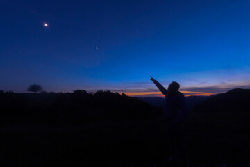 Fototapeta premium Amateur astronomer observing stars, planets and other celestial objects.