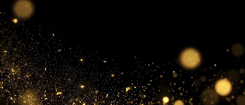 Gold bokeh particles drifting on black background