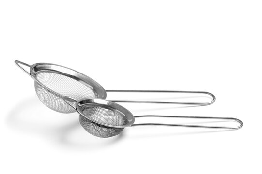 Food preparation and cooking, two stainless steel kitchen strainers for baking and culinary tasks isolated on a clean white background
