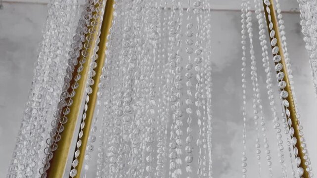 Gilded crystal chandelier close-up, camera movement