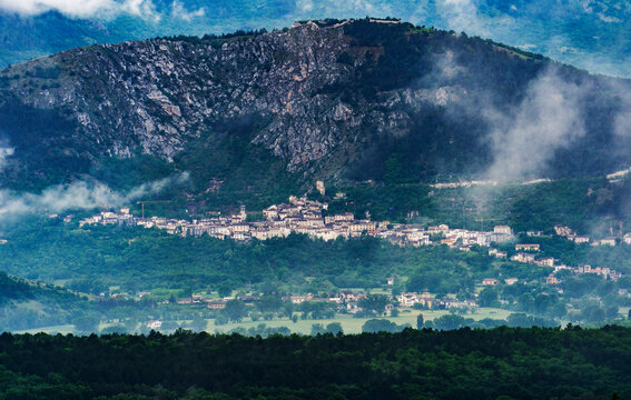 Scenic Mountain Village in Misty Landscape