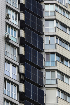 Solar panels and a battery storage system mounted on a modern apartment building in Kyiv, Ukraine, providing renewable energy and backup power for residential use.