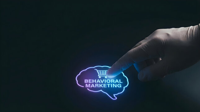 A hand wearing a glove presses a glowing digital brain icon representing behavioral marketing concepts