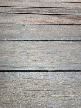 Close up of horizontal weathered wooden planks with perspective view, rustic wood grain texture background for design and backdrop use