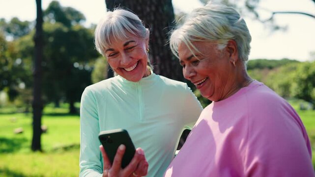 Fitness, phone and reading with old women in park for runner route, miles tracking and health. Wellness app, training guide and smile with senior friends outdoor for support and exercise progress