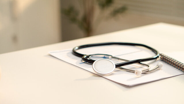 Health insurance concept. Stethoscope and calculator show healthcare costs on medical documents. health insurance, medical expenses, budgeting, financial planning, billing and patient care.