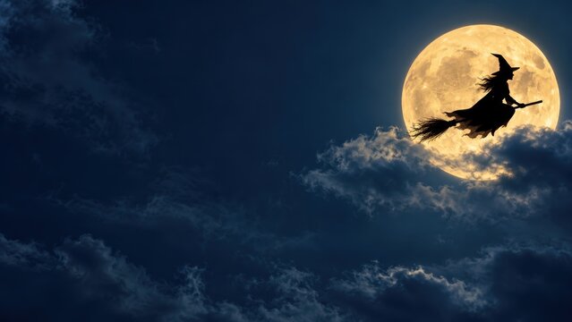Silhouette of a witch flying on broomstick against full bright glowing moon in dark night sky