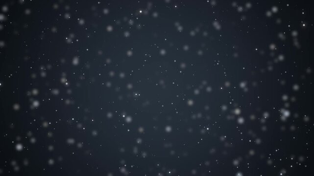 Field of bright particles recedes in depth drifting past the camera on a dark slate background