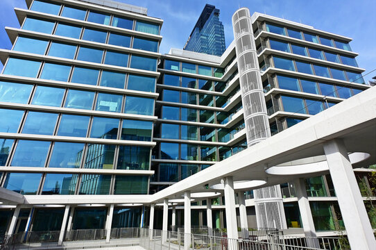Warsaw, Wola, Poland, Europe - 04.2026 : Towarowa 22 superquarter, futuristic mixed-use urban space , Warsaw Unit utra-modern skyscraper (Warta logo) in background, near Daszynskiego roundabout, CBD