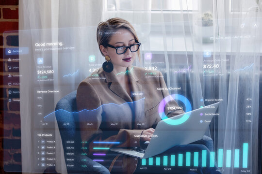  girl in blazer and glasses working withlaptop computer