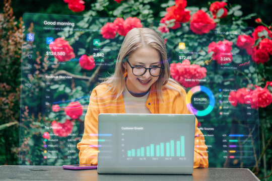 woman with laptop computer and business graphics 