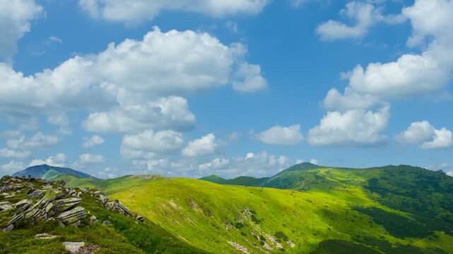 green mountain valley under dense cloudy sky time lapse scene