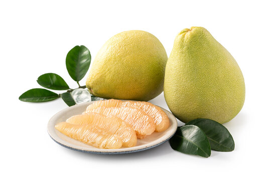 Fresh pomelo fruit with leaf isolated on white background with clipping path.