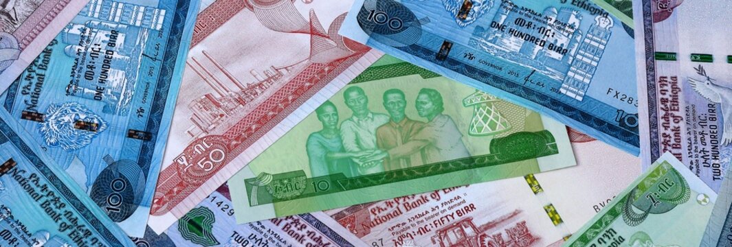 Big amount of Ethiopian birr money banknotes. Ethiopia cash bills of ETB currency close up