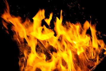 Fire flames hot burn sparks isolated in black background © Pavlo Vakhrushev