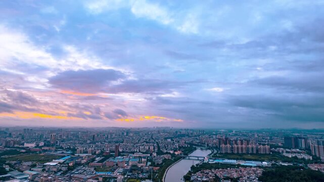 4K time lapse video of Rolling Clouds and City Skyline at Dawn Glow